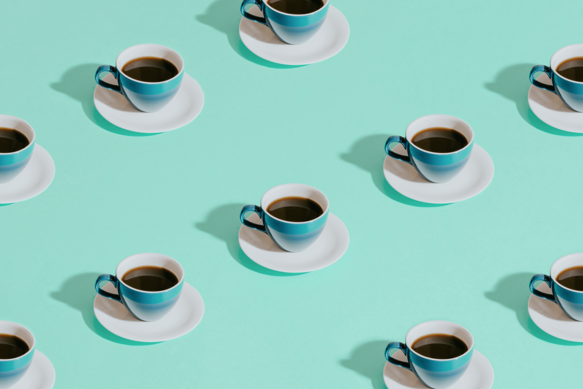 three cups of coffee are sitting on a saucer