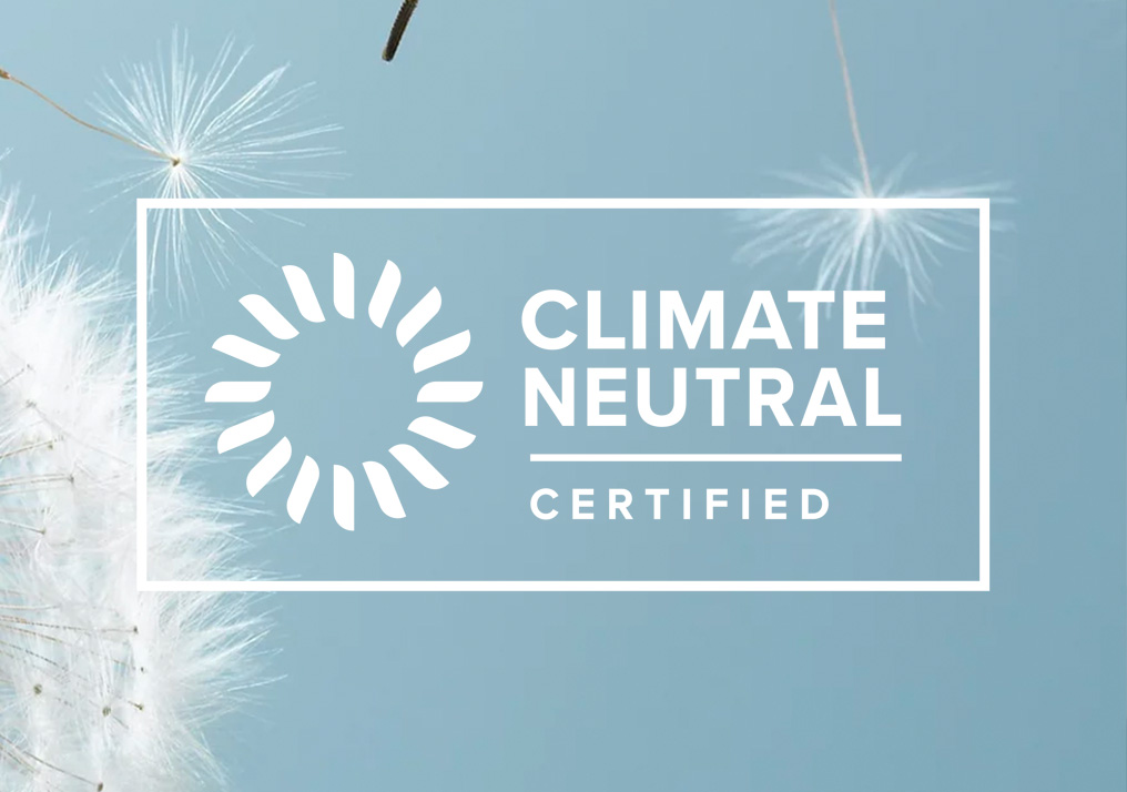 a dandelion with the words climate neutral certified
