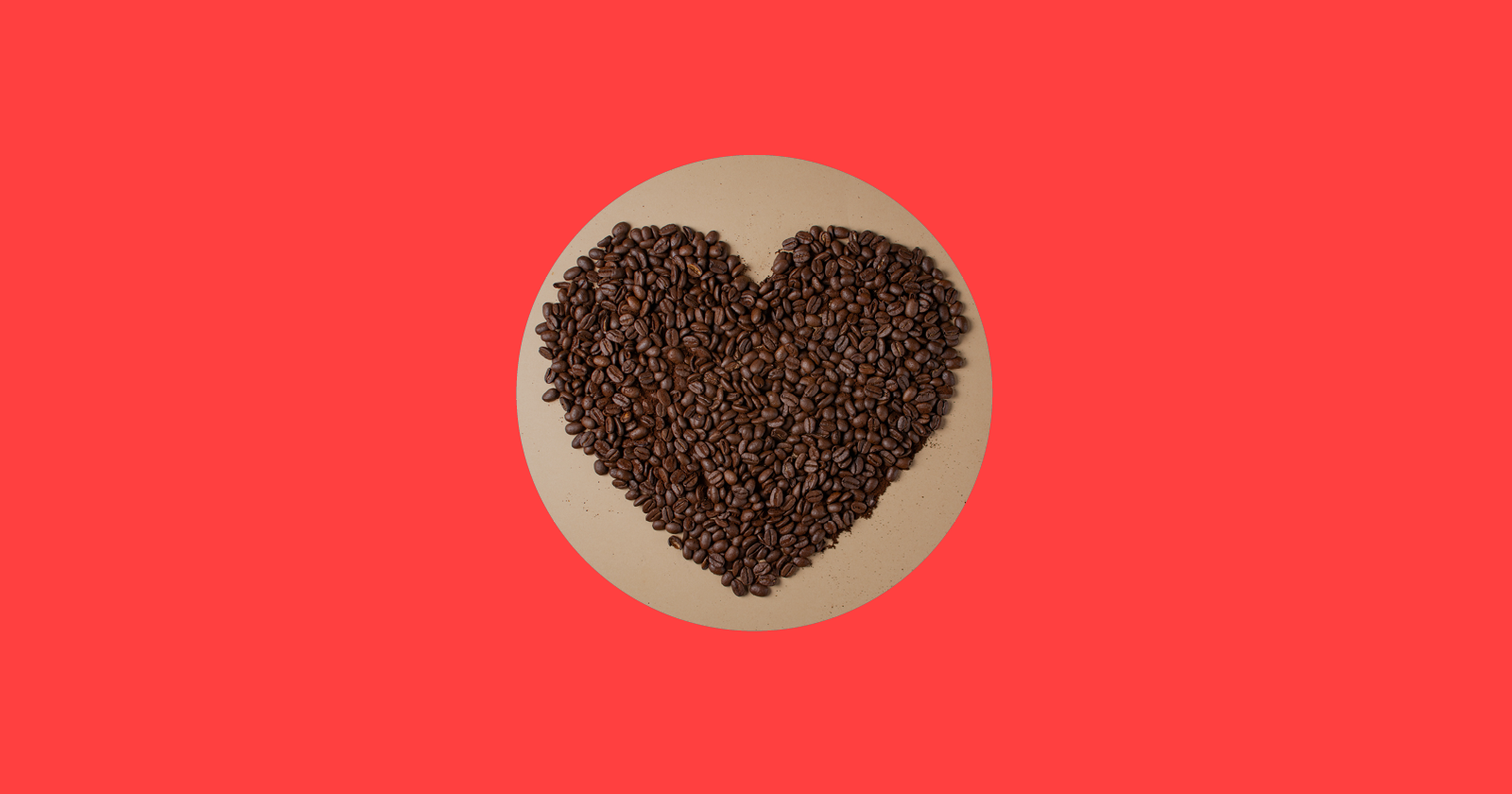 a heart made out of coffee beans on a plate